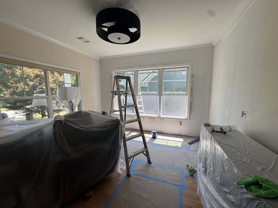 Renovation in progress — room prepped and protected for paint